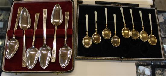 Two cased sets of silver spoons